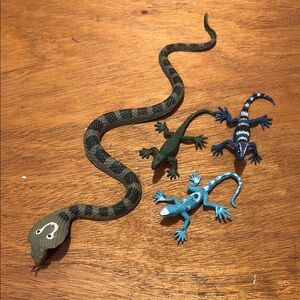 Assorted plastic lizards and snake